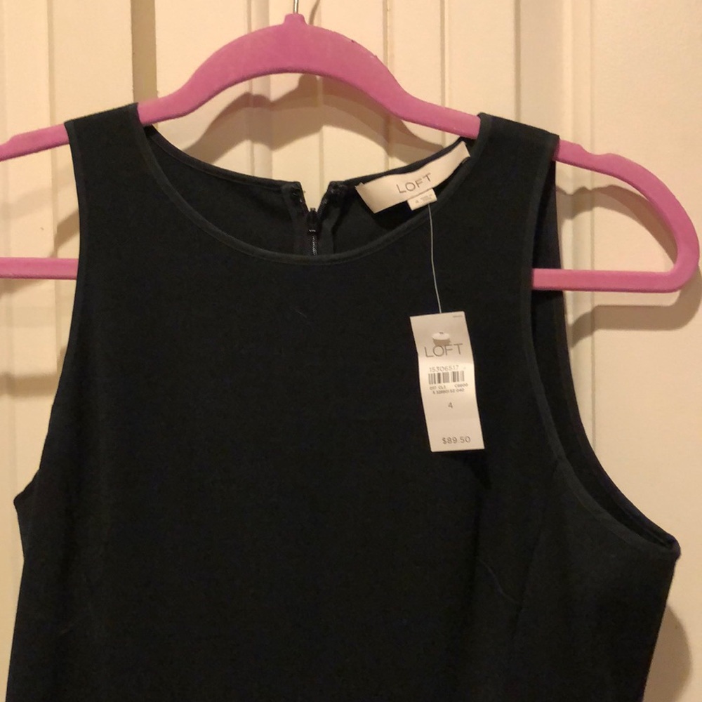 Black peplum sleeveless work dress